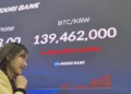 South Korea's Woori Bank displays bitcoin price alongside stocks and forex on trading floor