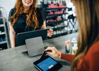 Why your card payment clears instantly but merchants wait days — and how that is changing