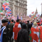 Tommy Robinson's rally sold merch, streamed ads, and promoted a crypto coin — that's the point